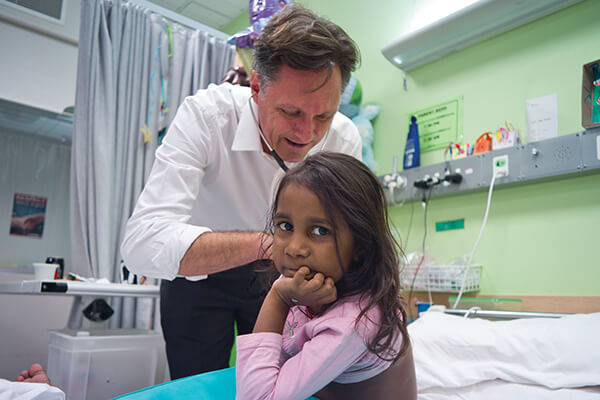 Professor Jonathan Carapetis tends to a patient with RHD